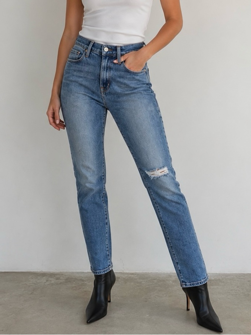 Frame Denim High-Rise Slim Straight Jeans in Light Blue with Knee Rip